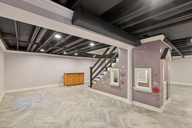 basement featuring ornamental molding and light parquet flooring