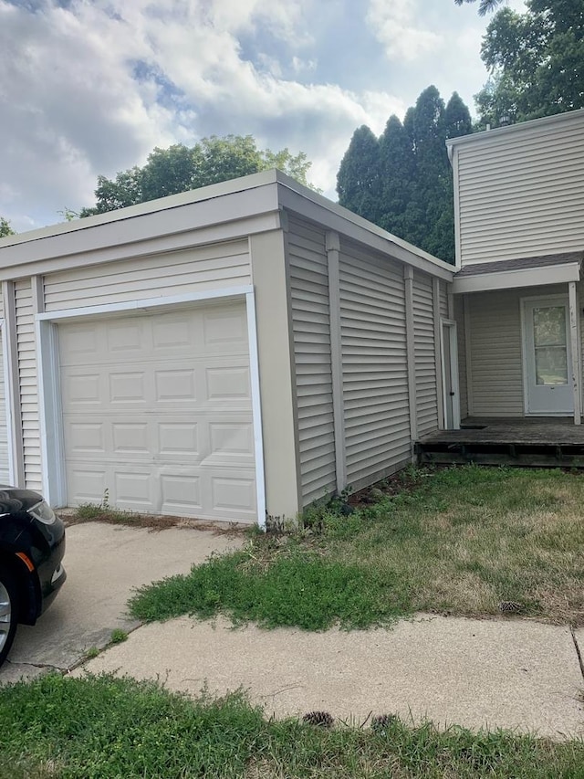 garage with a lawn