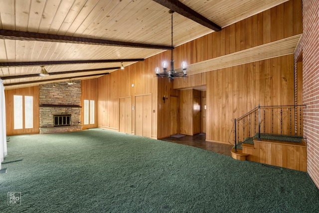 interior space featuring lofted ceiling with beams, dark colored carpet, wooden walls, and wooden ceiling