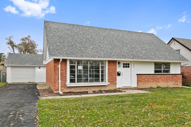 view of front facade with a front lawn and a garage