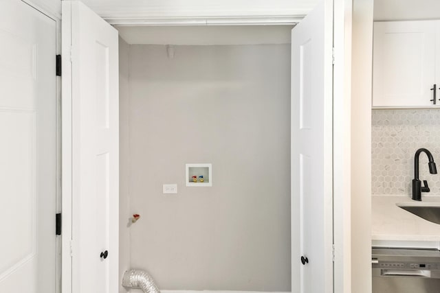 laundry room with hookup for a washing machine and sink