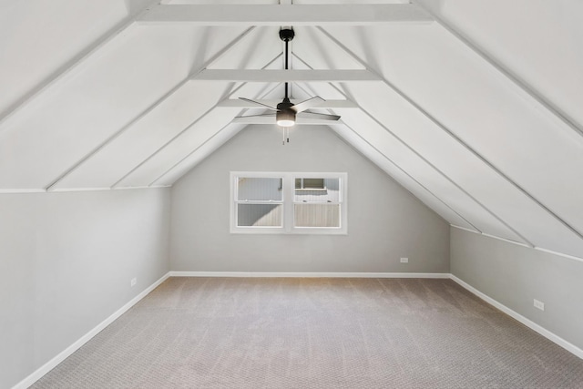 additional living space featuring ceiling fan, light colored carpet, and lofted ceiling