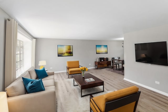 living room with light hardwood / wood-style floors