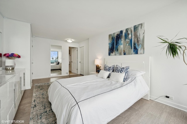 bedroom featuring light wood-type flooring