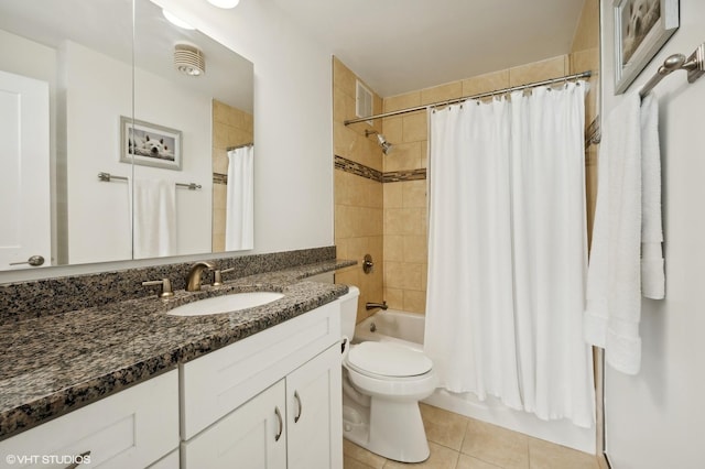 full bathroom with tile patterned flooring, vanity, shower / tub combo with curtain, and toilet