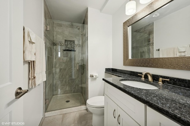 bathroom featuring tile patterned flooring, vanity, an enclosed shower, and toilet