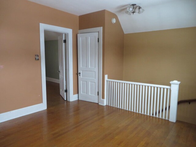 laundry area with dark hardwood / wood-style flooring and separate washer and dryer