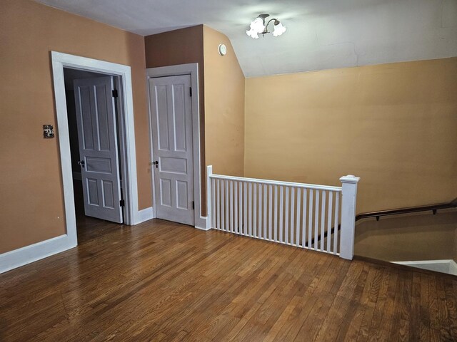 interior space with vaulted ceiling and hardwood / wood-style floors