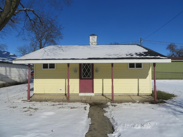 view of snow covered house