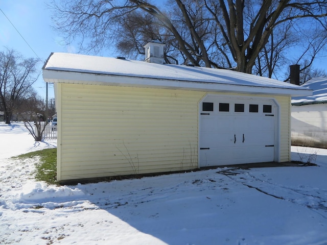 view of snow covered garage