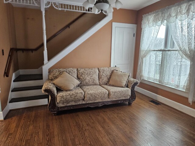 living room with dark wood-type flooring