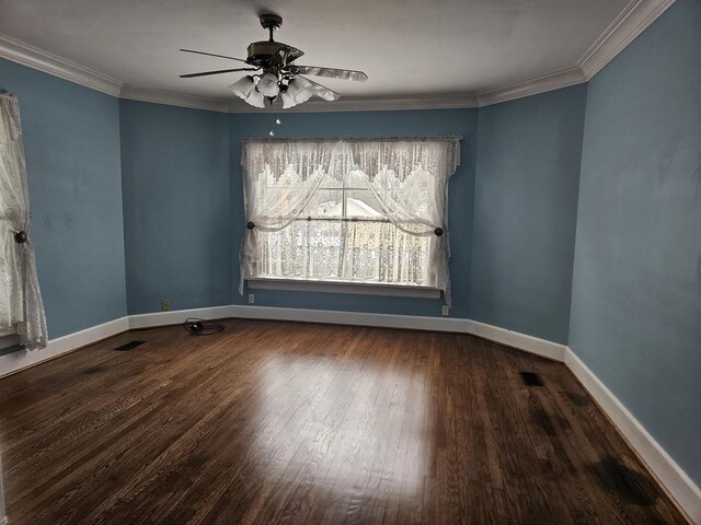 empty room featuring ceiling fan, dark hardwood / wood-style flooring, and ornamental molding