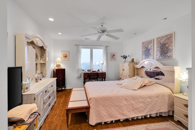 bedroom featuring ceiling fan and dark wood-type flooring