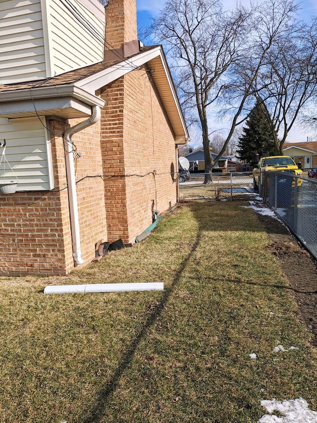 view of home's exterior with a lawn