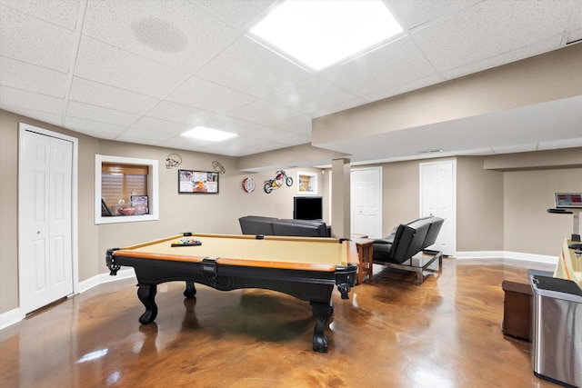 playroom featuring concrete flooring, a paneled ceiling, and billiards