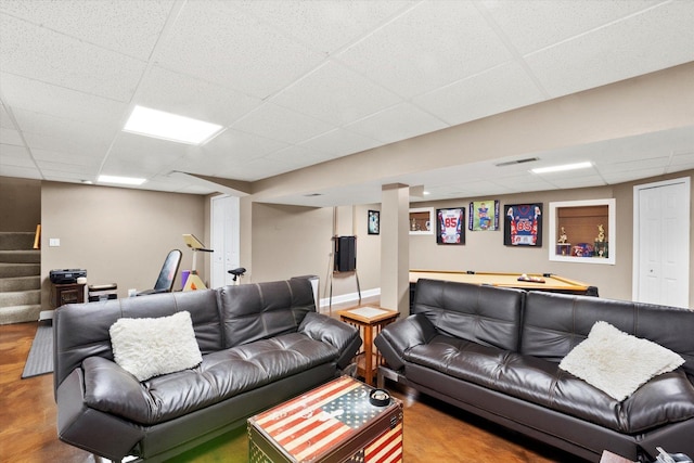 living room with a drop ceiling and billiards