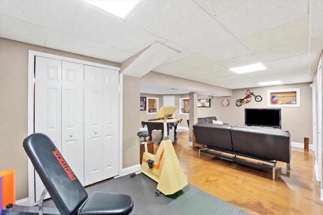 living room featuring a drop ceiling