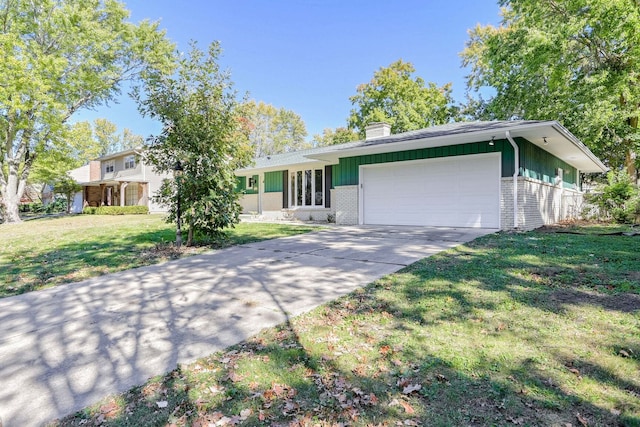 ranch-style house with a garage and a front lawn