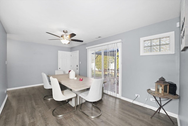 dining area featuring dark hardwood / wood-style floors and ceiling fan