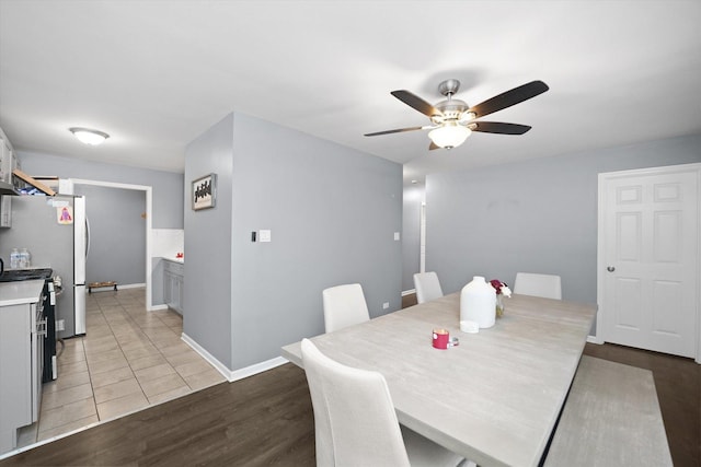 tiled dining room with ceiling fan