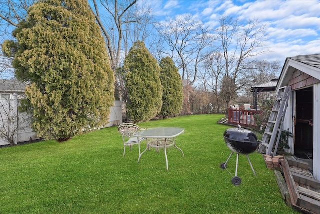 view of yard with an outdoor fire pit