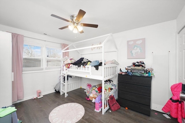 bedroom featuring ceiling fan and dark hardwood / wood-style flooring