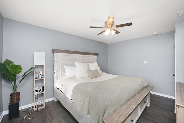 bedroom with dark hardwood / wood-style floors and ceiling fan