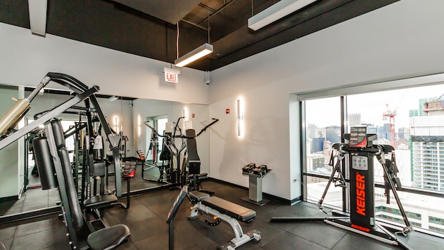 gym with a towering ceiling