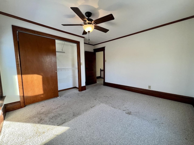 298 N Adams St, El Paso, IL 61738 - unfurnished bedroom featuring a closet, ceiling fan, light colored carpet, and crown molding