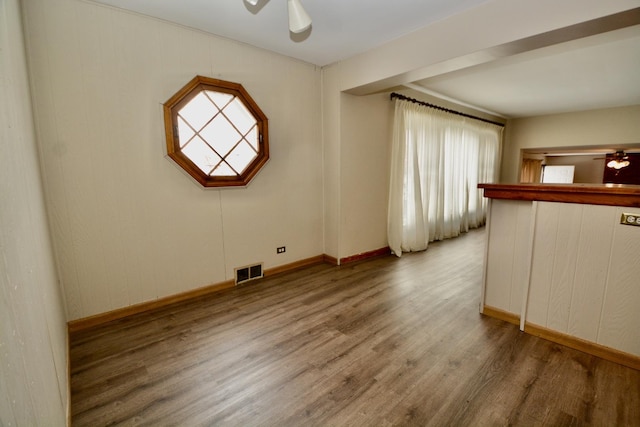 interior space featuring hardwood / wood-style floors and ceiling fan