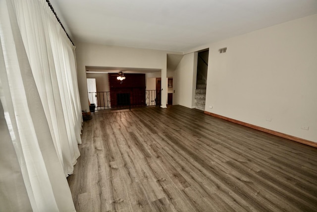 unfurnished living room featuring wood-type flooring