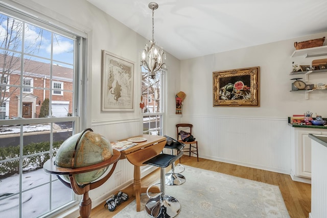 interior space with light wood-type flooring and a chandelier