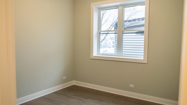 unfurnished room featuring dark hardwood / wood-style flooring