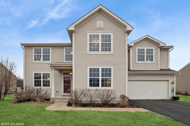 traditional-style house with aphalt driveway, a front yard, and an attached garage