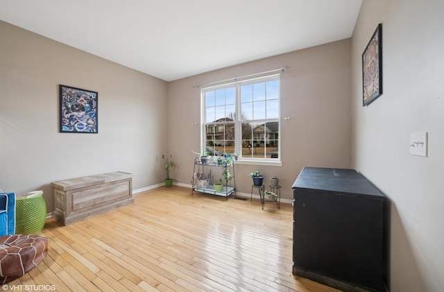 interior space featuring hardwood / wood-style floors and baseboards