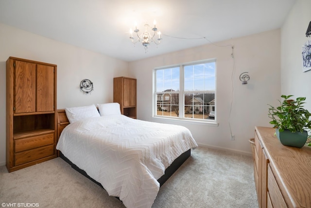 bedroom with light colored carpet and a notable chandelier