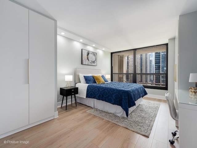 bedroom featuring light wood-type flooring