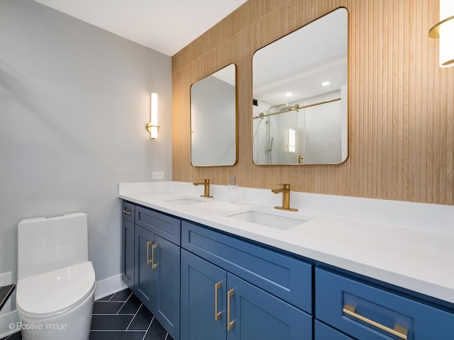 bathroom featuring tile patterned floors, vanity, toilet, and a shower