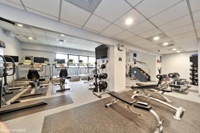 exercise room featuring a drop ceiling