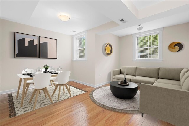 6750 N Greenview Ave Unit G, Chicago, IL 60626 - living area featuring wood finished floors, baseboards, and plenty of natural light