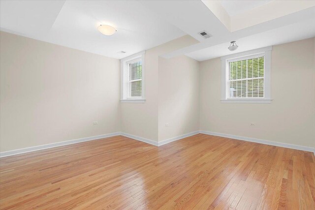 6750 N Greenview Ave Unit G, Chicago, IL 60626 - empty room featuring light wood finished floors, plenty of natural light, and baseboards