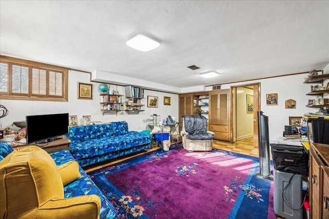 living room featuring a textured ceiling and carpet