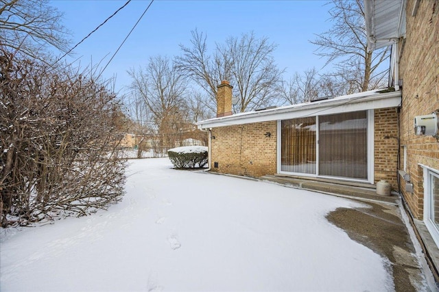 view of yard covered in snow