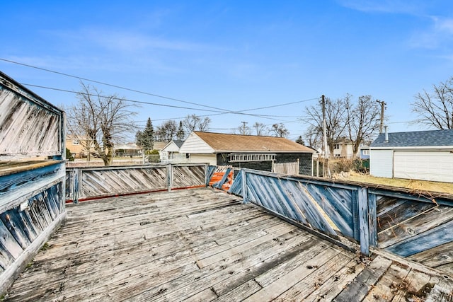 wooden terrace featuring an outdoor structure