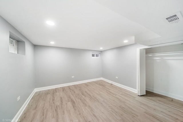 basement featuring light wood-type flooring