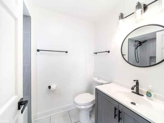 bathroom with vanity, a shower, tile patterned floors, and toilet