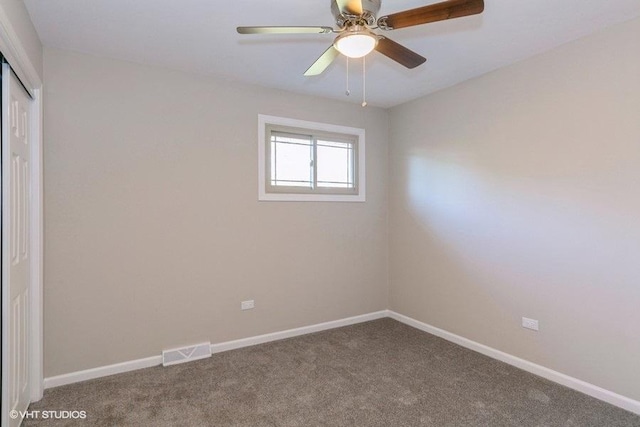 unfurnished room with carpet flooring and ceiling fan