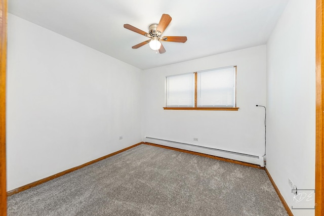 spare room with ceiling fan, carpet floors, and a baseboard heating unit