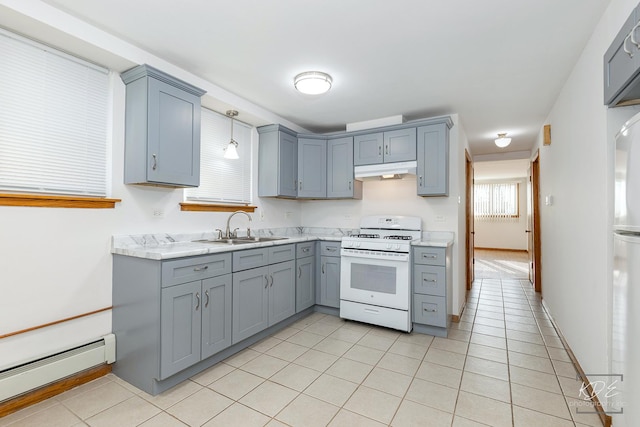 kitchen featuring light tile patterned floors, a baseboard heating unit, sink, decorative light fixtures, and white gas range