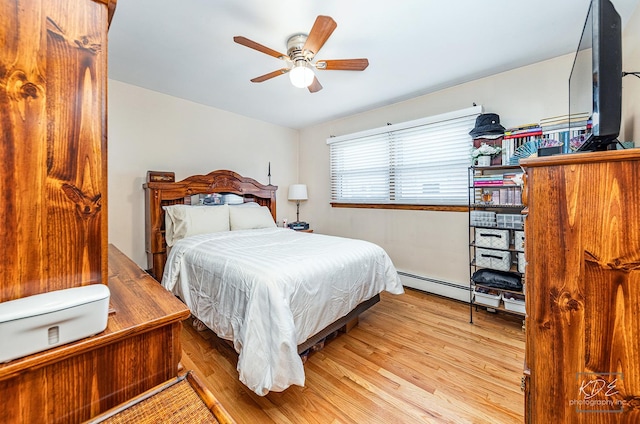 bedroom with ceiling fan, baseboard heating, and light hardwood / wood-style flooring